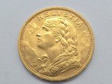 an image of a close up of a gold coin on a white surface