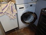 a washer and a dryer in a small room