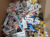 a cardboard box filled with various types of medicine