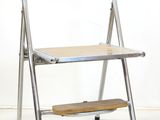 a chair that has a step stool on it