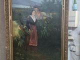 un tableau représentant une femme debout à côté d'un tableau représentant un homme