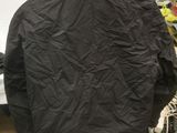 black jacket on a mannequin stand in a shop