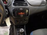 a dashboard of a small car with a clock on it