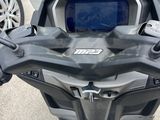 a close up of a motorcycle with a digital screen on the handlebars