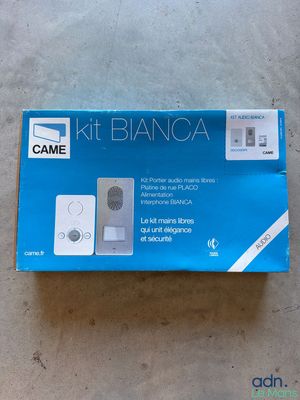 a box with a remote control on it sitting on a floor