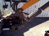 an image of a close up of a backhoe of a construction vehicle