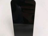 a close up of a cell phone on a table with a white background