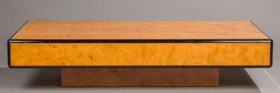 the table is made of wood and has a metal base