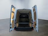 a white van with its doors open in a room