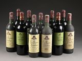six bottles of wine are lined up in a row on a table