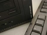 a computer keyboard and a computer mouse on a desk