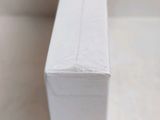 a close up of a white box on a table