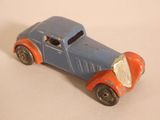 a toy car that is sitting on a white surface