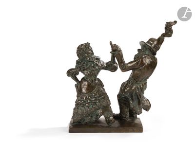 two bronze statues of a man and a woman holding hands