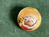 une pièce d'or sur laquelle est représenté un chien