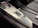 a close up of a car ' s dashboard with a remote control