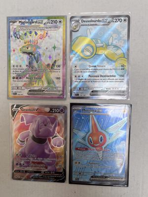 four different pokemon cards sitting on top of each other on a table