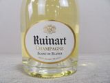 a bottle of wine that is sitting on a table