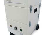 an image of a white machine sitting on top of a white table
