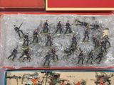 a lot of toy soldiers in a box on the table