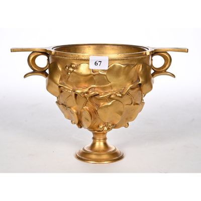 gold plated vase with handles and handles on a white background