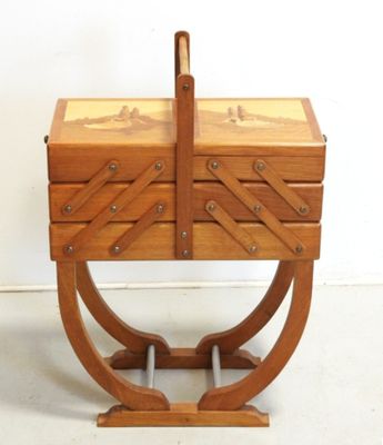 an image of a wooden box with a handle on a stand