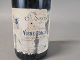 a close up of a bottle of wine on a table