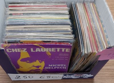 a box full of records sitting on a table