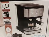 packaging of a coffee machine sitting on top of a table