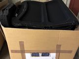 a cardboard box with a black object inside of it