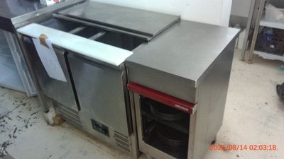 a stainless steel counter top with a sink and a dishwasher in it