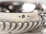 a silver bowl that is sitting on a table