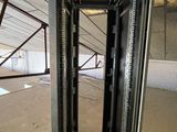 a large open metal rack in the middle of a building