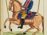 an old book with a picture of a man riding a horse