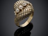 a gold and diamond ring with a snake ' s head