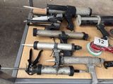 many different types of nail guns on a table