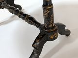 a close up of a table with a black and gold design on it