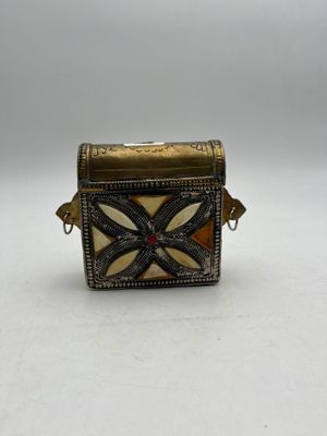 an image of a small box with a cross design on it