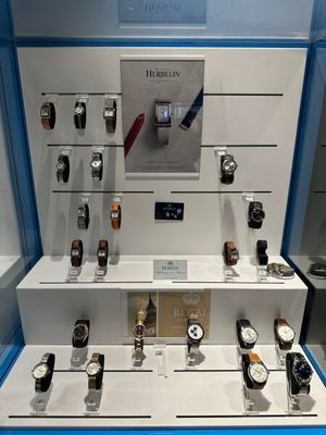 many different watches on display in a glass case