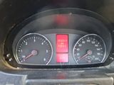 a close up of a car dashboard with gauges and numbers