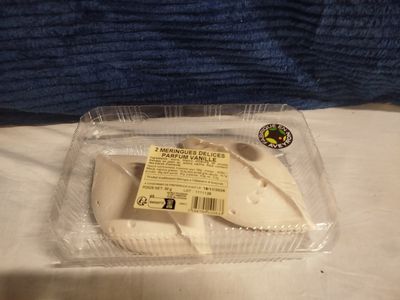a plastic container with a piece of cheese in it