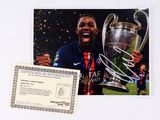 a picture of a man holding a trophy and a certificate