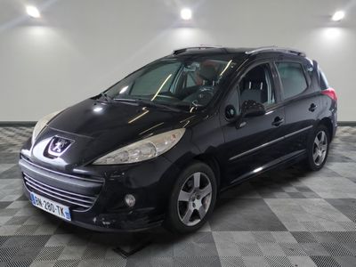 a picture of a small black car parked in a garage