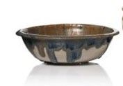 a brown and blue bowl sitting next to a brown and white vase