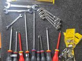 a lot of tools that are laying out on the floor