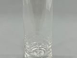 a clear glass that is sitting on a table