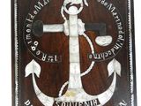 wooden plaque with an anchor and rope on it on a white background