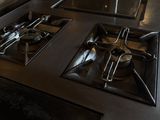 a kitchen with a stove and a sink in it