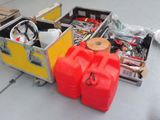 two red containers sitting next to each other on the floor