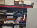 many files on a shelf in a room